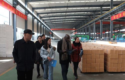 Ugandan customers visit the company